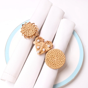 Rattan napkin rings set featuring sunflower, heart with pearl, and woven round shapes