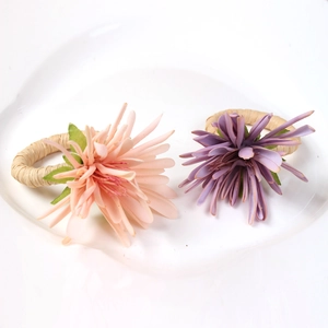 Elegant champagne floral napkin rings with handmade woven bands for wedding table decor