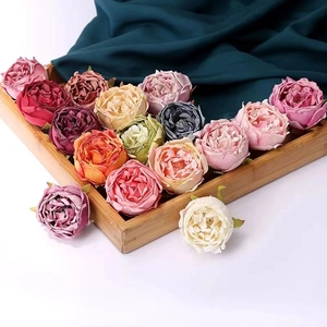 Peony napkin ring set in Morandi colors on a dark silk backdrop for table decor