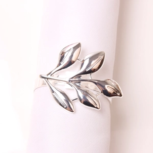 Polished silver leaf napkin ring with a sleek metallic finish for elegant table settings