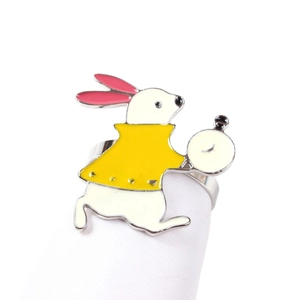Cartoon white rabbit enamel napkin ring with pocket watch design on a white stand