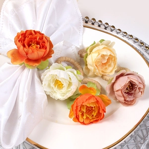Handmade floral napkin rings with faux peony roses and woven grass loops for table decor