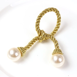 Golden woven rope napkin ring with large white pearls for wedding table decor