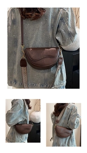 Detail of dark brown saddle bag with retro leather texture and two stylish straps
