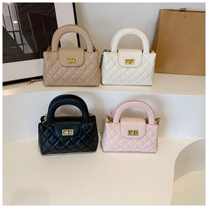 Detailed view of quilted chain bags in beige, white, black and pink with metal locks