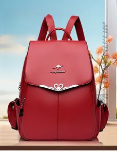 Detail of red lychee pattern PU leather backpack with heart swan hardware and kangaroo logo