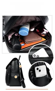 Detail view of large capacity black pebbled leather backpack with multi-layer storage compartments