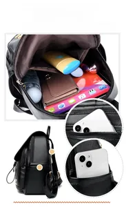 Detail view of large capacity black pebbled leather backpack showing interior storage space