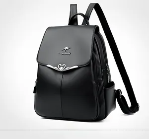 Close-up of black lychee grain leather backpack with kangaroo logo and heart buckle
