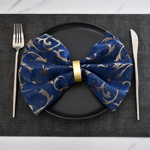 Minimalist matte gold napkin ring with luxury navy blue floral embroidered dinner napkin