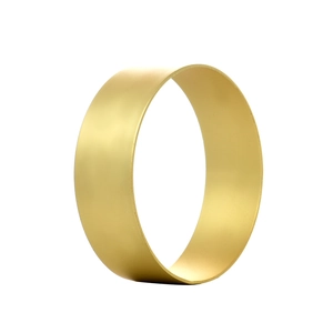 Minimalist matte gold metal napkin ring with smooth finish on white background