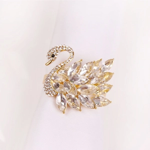Luxurious swan-shaped crystal napkin ring with gold metal and sparkling diamonds