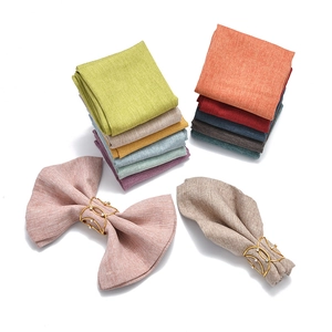 Close-up of colorful linen napkins with sparkling gold rhinestone napkin rings for decor