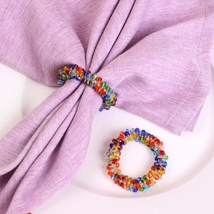 Set of two colorful crystal beaded napkin rings for elegant holiday dining table decor