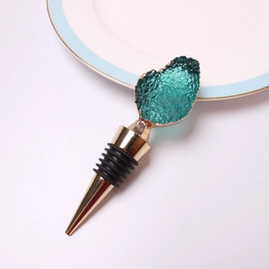 Detail of emerald green crystal wine stopper with gold plating and rubber seal rings