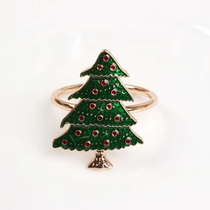 Detail of Christmas tree napkin ring with green enamel and red crystal accents