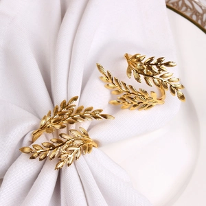 Macro detail of golden wheat ear napkin ring with intricate leaf veins and metallic texture