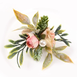 Artificial double rose and pine cone napkin ring with pearls for elegant table decor