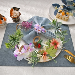 Artificial rose and lavender flower napkin rings set with rustic woven vine base