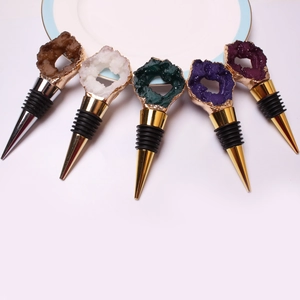 Five-piece set of wine stoppers featuring assorted natural crystal and agate clusters
