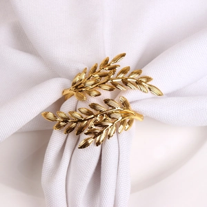 Elegant gold leaf napkin ring with olive branch design for luxury table setting decoration