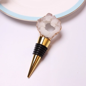 Elegant gold wine stopper with white crystal cluster top and black rubber seal rings