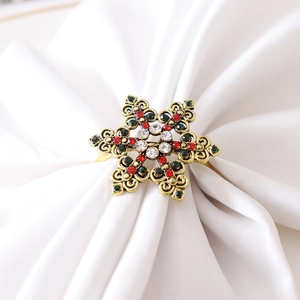 Elegante portatovagliolo a fiocco di neve dorato con strass colorati per Natale