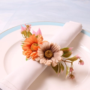 Elegant sunflower napkin ring set with orange and pink silk flowers for wedding decor