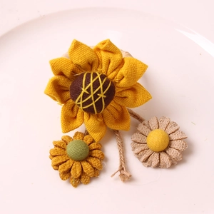 Three-piece handmade burlap sunflower napkin rings in rustic farmhouse country style