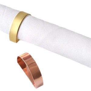 Modern metal napkin ring set in gold and rose gold finish for elegant table settings
