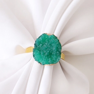 Elegant green druzy agate napkin ring with gold spiral wire for upscale table setting