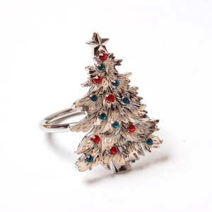 Close-up of silver Christmas tree napkin ring with star top and colorful rhinestones