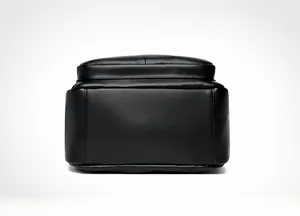 Close-up of litchi grain leather backpack base featuring stitched seams and logo