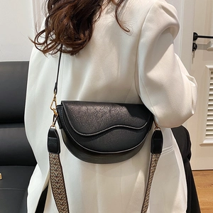 Retro black saddle bag with vintage texture and stylish woven strap for women