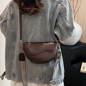 Retro dark brown leather saddle bag with wave flap and two interchangeable straps