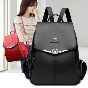 Minimalist soft leather backpack for women featuring flap cover and metal kangaroo logo