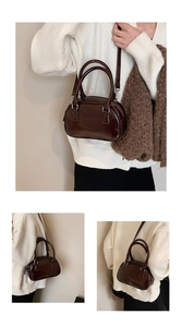 Detail of glossy coffee PU bowling bag showing the top handles and silver hardware