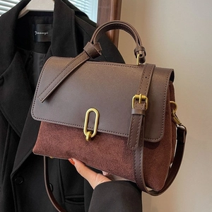 Brown vintage minimalist leather handbag with metal buckle and shoulder strap for women