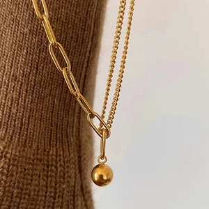 Double-layered gold titanium steel necklace with paperclip chain and round ball pendant