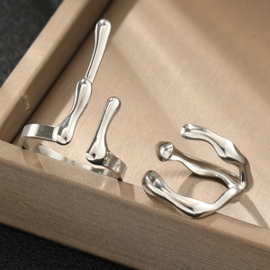 Set of two silver irregular liquid metal rings with a polished finish and adjustable open band