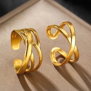 Gold layered crisscross open ring featuring artistic hollow lines in polished stainless steel