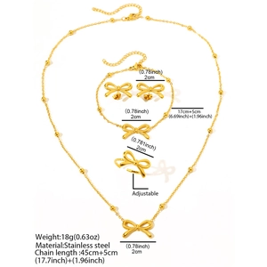 Detailed dimensions of 4-piece golden stainless steel jewelry set with bowknot design