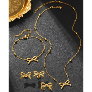 4-piece golden bow jewelry set with necklace, bracelet, ring, and earrings for women