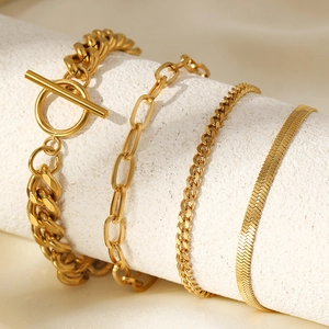 Four-piece gold stainless steel chain bracelet set featuring OT clasp and Cuban links