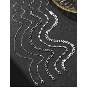 Set di cinque cavigliere in acciaio inossidabile argento con catena cubana e onde