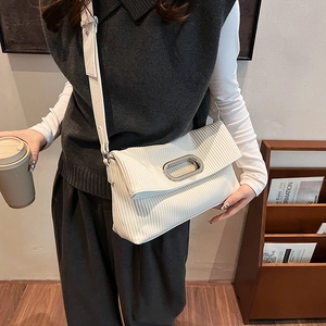 White pleated underarm bag with silver oval buckle and wide shoulder strap