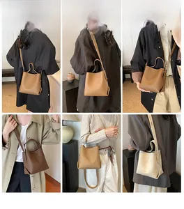 Litchi pattern bucket bag shown in multiple earth tones with adjustable shoulder strap