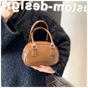 Brown PU leather bowling bag with round double handles and elegant silver hardware detail