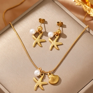 Starfish and shell jewelry set with gold snake chain and pearls in a gift box