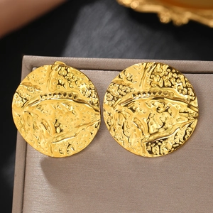 Macro view of 18k gold plated stainless steel stud earrings with irregular hammer texture